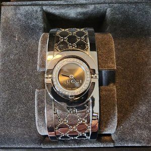 Gucci Watch with diamonds.